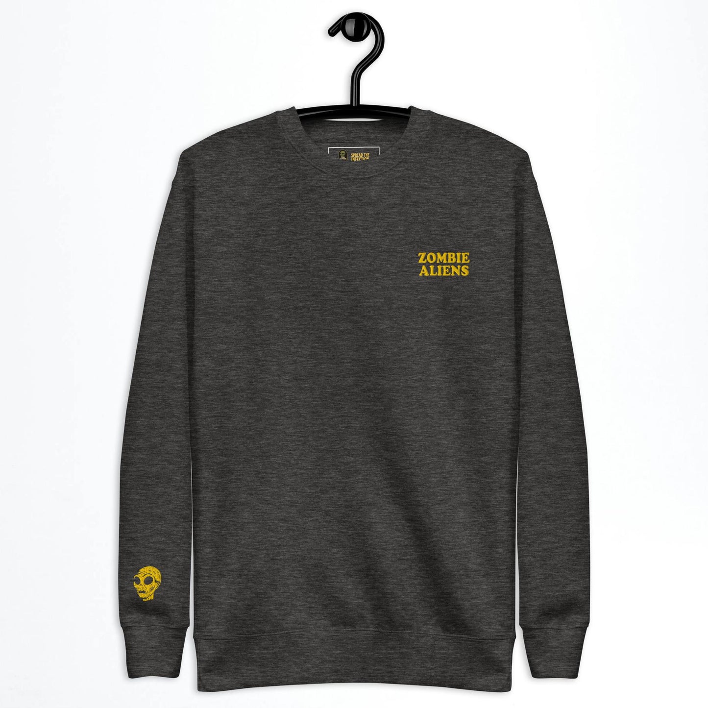 Grey sweatshirt with 'Zombie Aliens' text on a hanger against a white background
