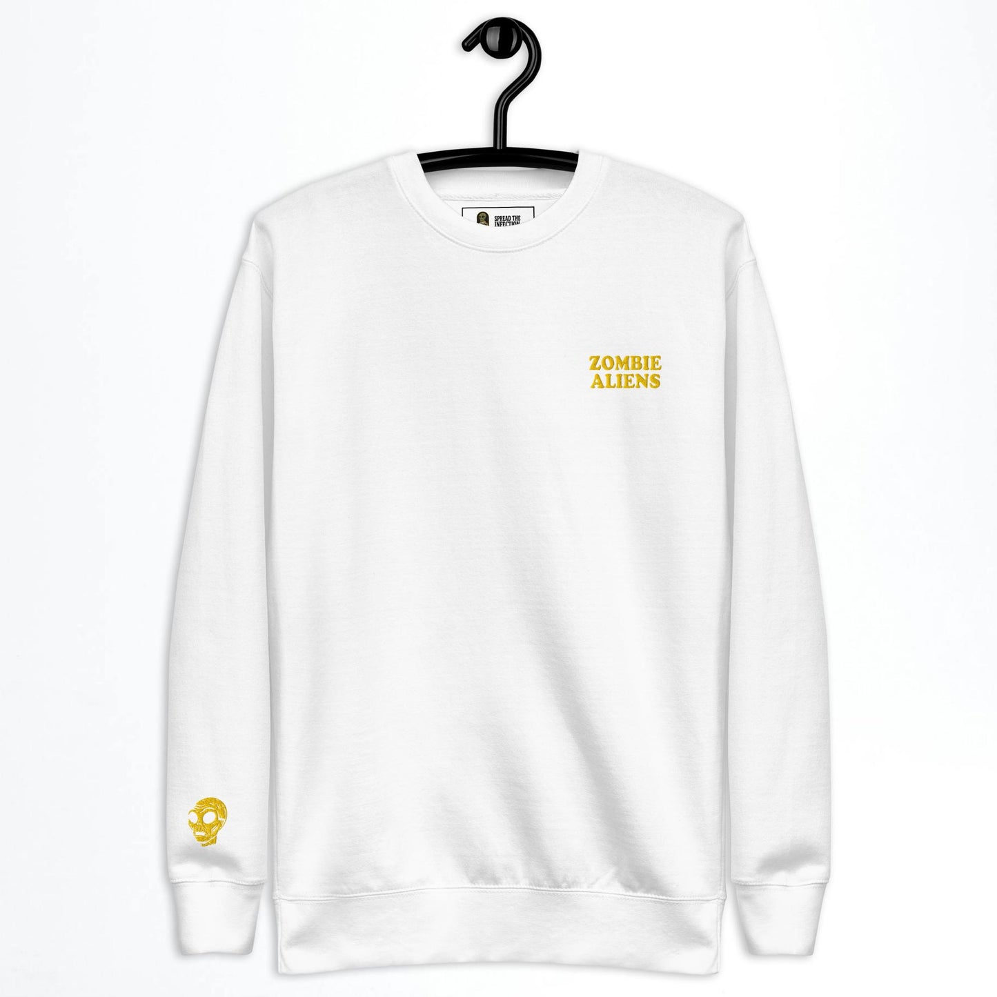 White sweatshirt with 'Zombie Aliens' text on a hanger against a white background